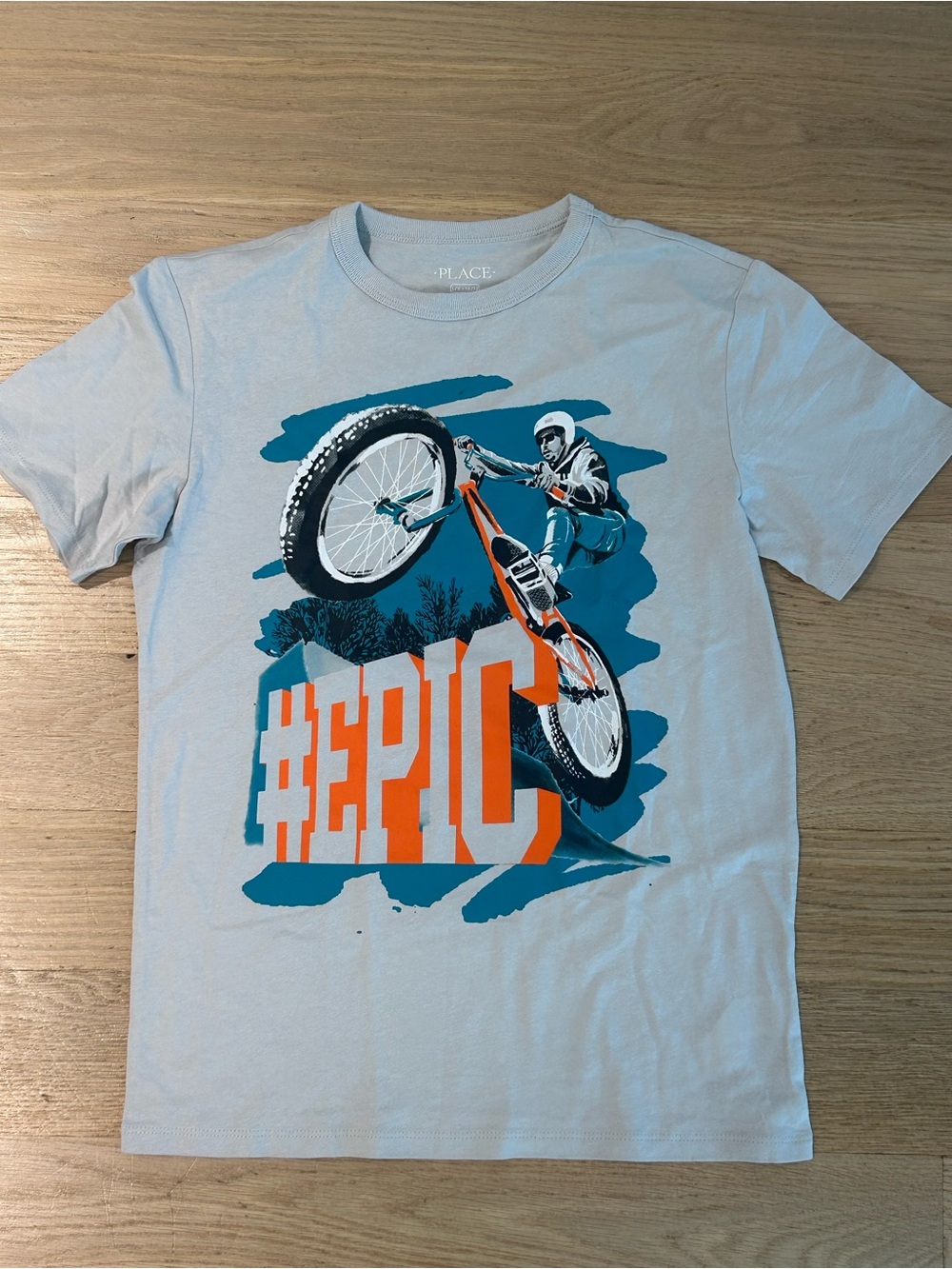 Place Light Blue Tee with Orange and Teal BMX Graphic
